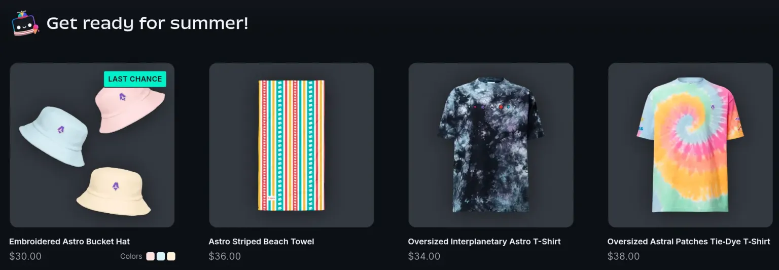 A row of summer-themed Astro merch, including pastel bucket hats, a tie-dyed t-shirt, and a colorful beach towel.